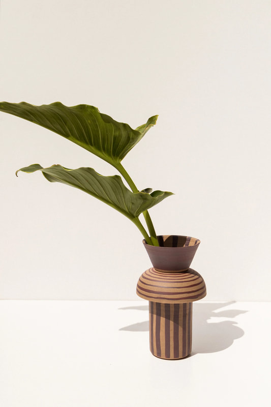 ceramic vase with stripes and leaves handmade by belinda wiltshire