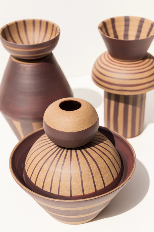 three ceramic vases with stripes handmade by belinda wiltshire