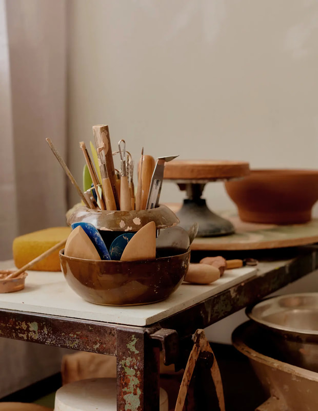 pottery tools in a handmade container in the pottery studio of belinda wiltshire